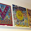Original and reproduction backglasses lined the walls above the pinball machines
