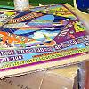 Each pinball backglass is cling wrapped and taped to sturdy cardboard.