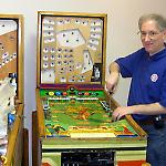 Volunteer Joel Shprentz works on Gottlieb's 1950 Bank-A-Ball.