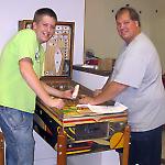 Volunteers Casey and Chuck Gardner work on Gottlieb's Just 21.