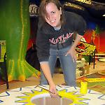 Artist Angela Annecchino paints a giant pop bumper cap.
