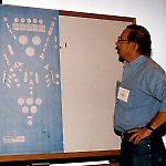 Ed Cebulas examines a paper mockup of Olympiad Pinball.