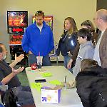 National Pinball Museum founder David Silverman discusses games with purchasers.