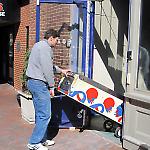 A new owner carts Gottlieb's Pro Football out of the National Pinball Museum.