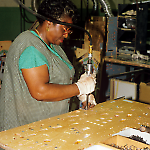 Installing T-nuts on a Taxi playfield at the Williams Pinball Factory