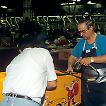 Installing Taxi cabinet parts at the Williams pinball factory