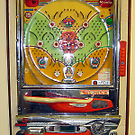 Mizuho pachinko game is flush mounted in gameroom wall.